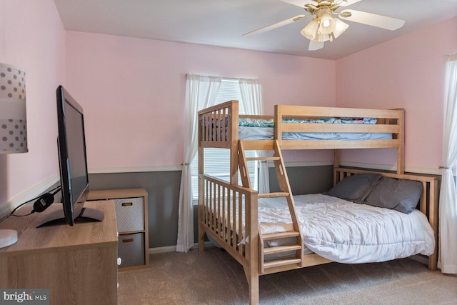 carpeted bedroom featuring baseboards