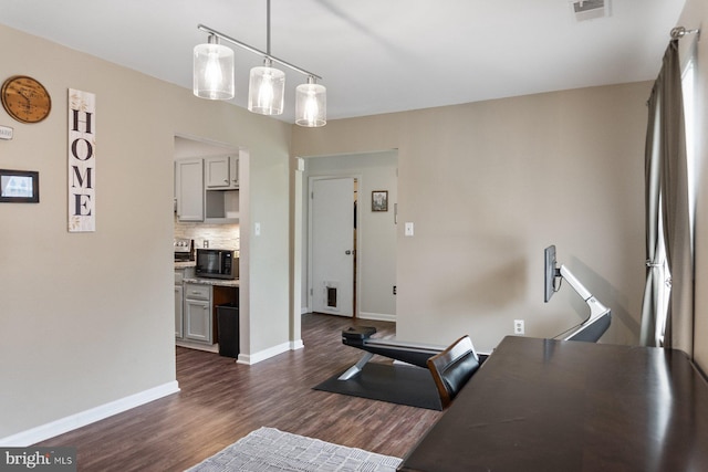 office with dark wood finished floors and baseboards