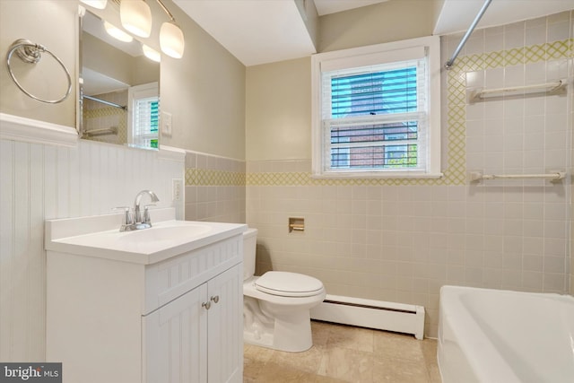 full bathroom with a baseboard heating unit, a wainscoted wall, toilet, tile patterned flooring, and vanity