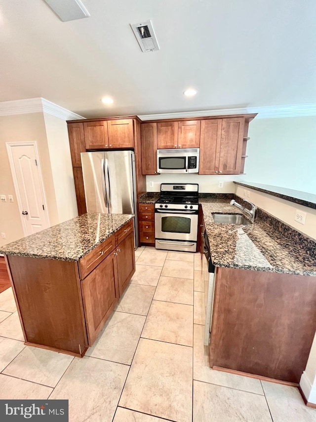 kitchen featuring appliances with stainless steel finishes, crown molding, a sink, open shelves, and dark stone countertops