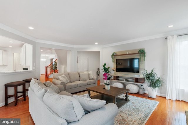 13626 Sylvan Bluff Dr, Leesburg, VA 20176 - living area featuring stairway, light wood-style flooring, ornamental molding, and recessed lighting