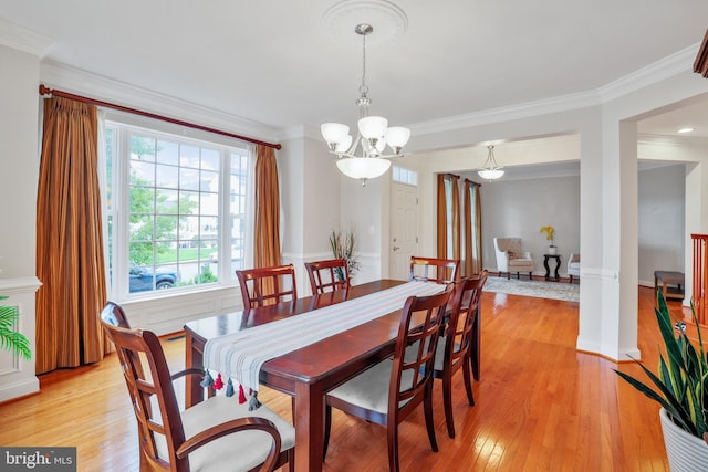 13626 Sylvan Bluff Dr, Leesburg, VA 20176 - dining space with a chandelier, crown molding, and light wood finished floors