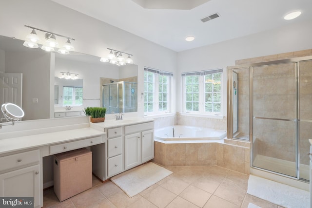 13626 Sylvan Bluff Dr, Leesburg, VA 20176 - full bathroom featuring tile patterned floors, a bath, a stall shower, and vanity