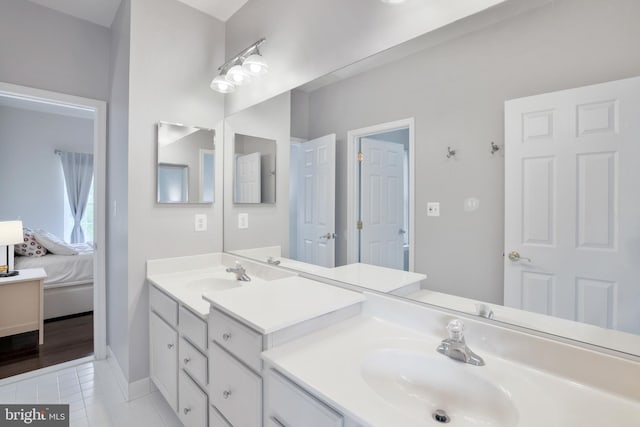 13626 Sylvan Bluff Dr, Leesburg, VA 20176 - ensuite bathroom with double vanity and tile patterned floors