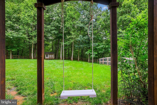 13626 Sylvan Bluff Dr, Leesburg, VA 20176 - view of yard with an outdoor structure and a wooded view