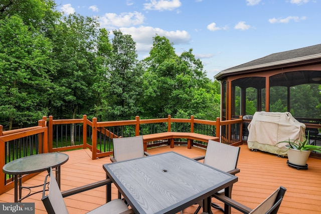 13626 Sylvan Bluff Dr, Leesburg, VA 20176 - wooden deck with outdoor dining area, a grill, and a sunroom