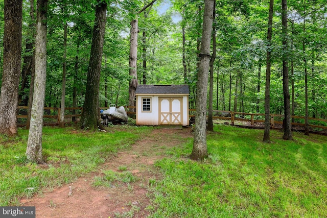 13626 Sylvan Bluff Dr, Leesburg, VA 20176 - view of yard featuring a storage shed and a wooded view