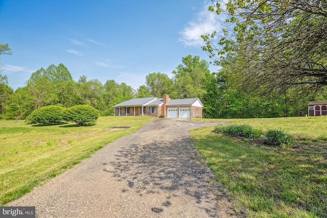 13245 Croom Rd, Upper Marlboro, MD 20772 - ranch-style home with a chimney, asphalt driveway, a front lawn, an attached garage, and brick siding