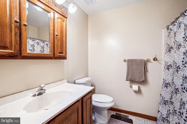 13245 Croom Rd, Upper Marlboro, MD 20772 - bathroom featuring toilet, vanity, baseboards, a shower with shower curtain, and tile patterned flooring