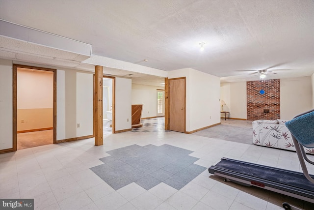 13245 Croom Rd, Upper Marlboro, MD 20772 - living room featuring baseboards, a textured ceiling, and a ceiling fan