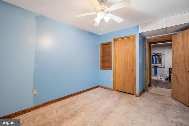 13245 Croom Rd, Upper Marlboro, MD 20772 - unfurnished bedroom with concrete flooring, baseboards, a closet, and a ceiling fan
