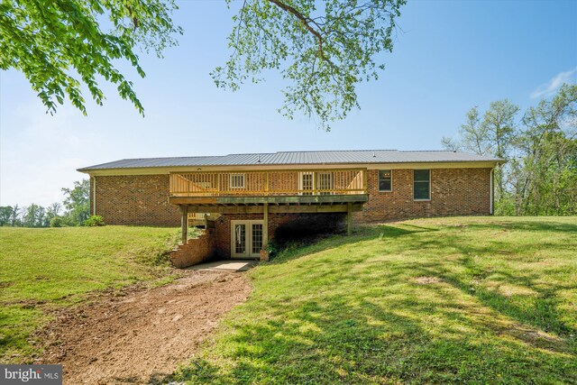 13245 Croom Rd, Upper Marlboro, MD 20772 - back of property featuring french doors, a deck, a yard, and brick siding