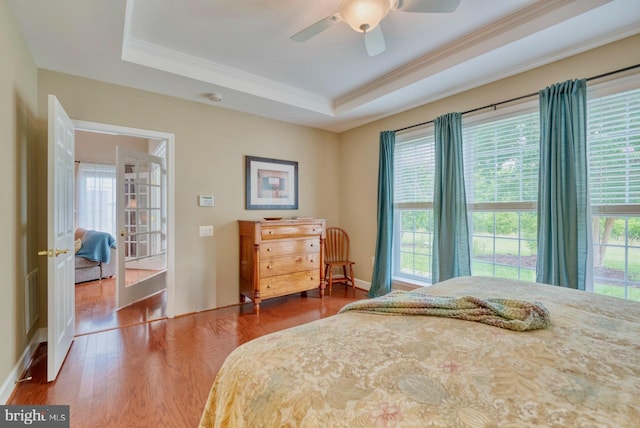 44458 Maltese Falcon Sq, Ashburn, VA 20147 - bedroom with a raised ceiling, ornamental molding, wood finished floors, a ceiling fan, and baseboards