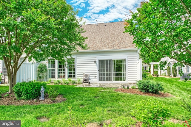 44458 Maltese Falcon Sq, Ashburn, VA 20147 - rear view of house featuring roof with shingles
