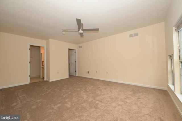 unfurnished bedroom featuring carpet, baseboards, and a ceiling fan