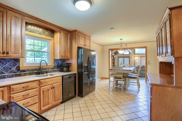 621 E Walnut St, Palmyra, PA 17078 - kitchen with black appliances, tasteful backsplash, light tile patterned floors, and decorative light fixtures