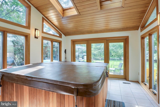621 E Walnut St, Palmyra, PA 17078 - rec room with lofted ceiling, light tile patterned flooring, french doors, wooden ceiling, and a skylight