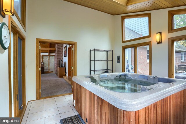 621 E Walnut St, Palmyra, PA 17078 - kitchen featuring a high ceiling, wooden ceiling, light tile patterned floors, and light colored carpet