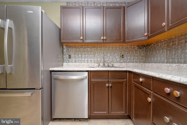 84 Transverse Unit 84, Middle River, MD 21220 - kitchen featuring appliances with stainless steel finishes, tasteful backsplash, and a sink