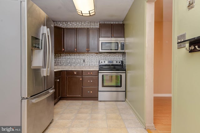 84 Transverse Unit 84, Middle River, MD 21220 - kitchen with appliances with stainless steel finishes, dark brown cabinetry, decorative backsplash, and light countertops