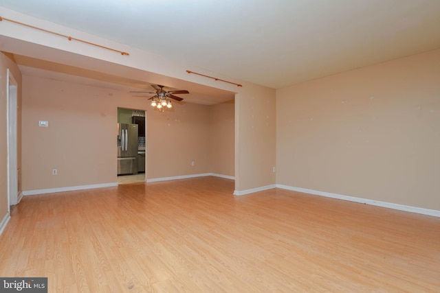 84 Transverse Unit 84, Middle River, MD 21220 - spare room featuring light wood-style floors, baseboards, and ceiling fan