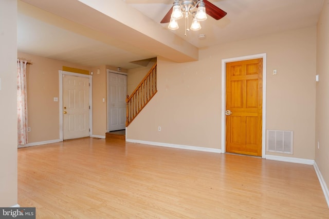 84 Transverse Unit 84, Middle River, MD 21220 - unfurnished living room featuring wood finished floors, ceiling fan, baseboards, and stairs