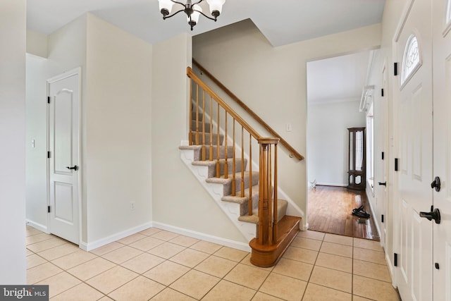 3547 Green Spring Rd, Havre De Grace, MD 21078 - entryway featuring light tile patterned floors, a chandelier, stairway, baseboards, and crown molding