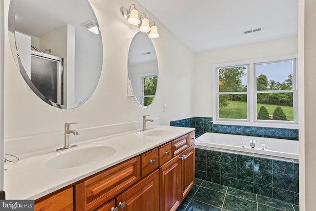 3547 Green Spring Rd, Havre De Grace, MD 21078 - full bath with healthy amount of natural light, tile patterned floors, double vanity, and a garden tub