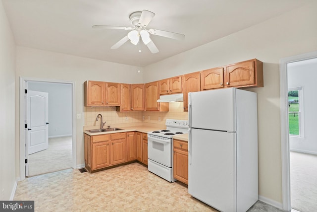 3547 Green Spring Rd, Havre De Grace, MD 21078 - kitchen featuring white appliances, under cabinet range hood, a sink, light countertops, and tasteful backsplash