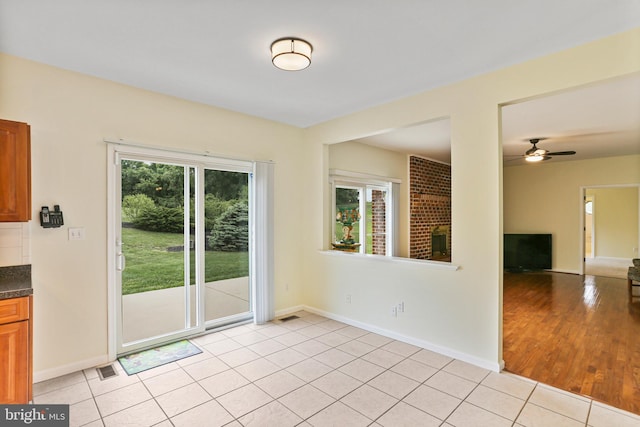 3547 Green Spring Rd, Havre De Grace, MD 21078 - unfurnished dining area with ceiling fan, baseboards, and light tile patterned flooring