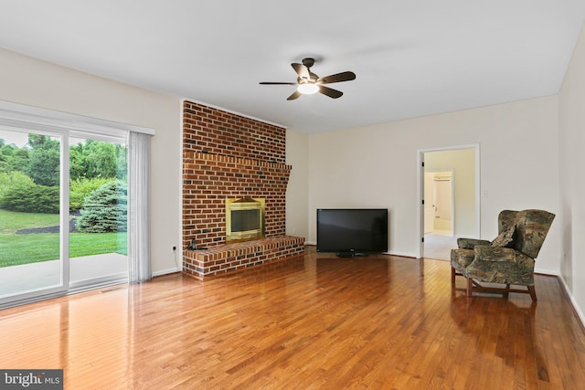 3547 Green Spring Rd, Havre De Grace, MD 21078 - living area with ceiling fan, wood finished floors, and a brick fireplace