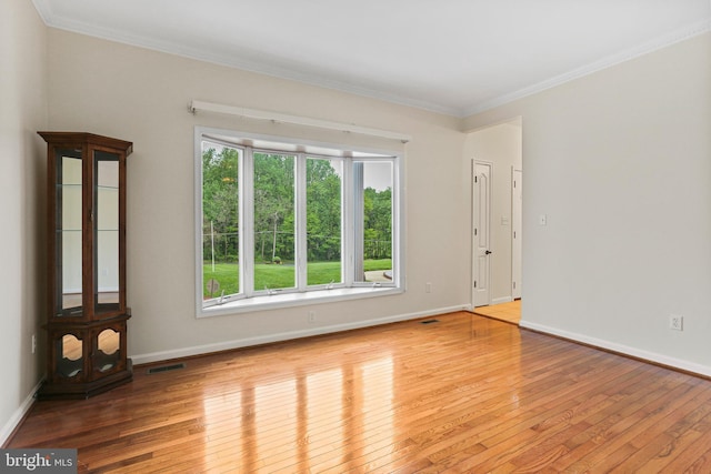 3547 Green Spring Rd, Havre De Grace, MD 21078 - spare room featuring healthy amount of natural light, hardwood / wood-style floors, ornamental molding, and baseboards