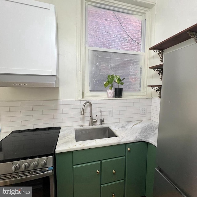 2947 W Girard Ave, Philadelphia, PA 19130 - kitchen featuring green cabinets, a sink, appliances with stainless steel finishes, decorative backsplash, and open shelves