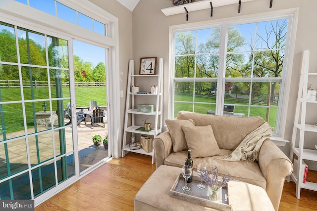 sunroom with plenty of natural light and vaulted ceiling