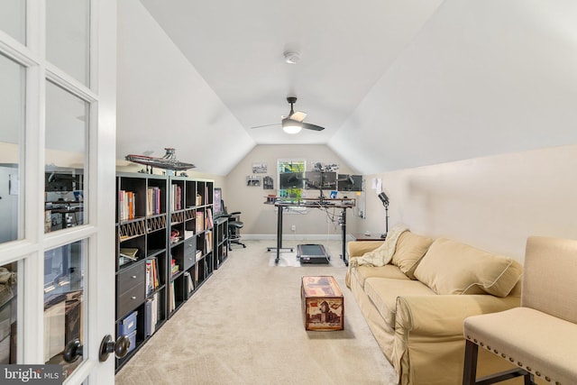 sitting room featuring carpet floors, lofted ceiling, baseboards, and a ceiling fan
