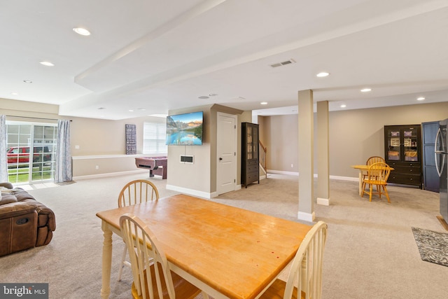 dining area with light carpet, baseboards, and recessed lighting
