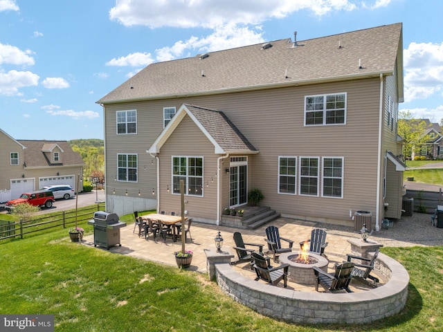 rear view of property with an outdoor fire pit, a patio area, and central AC