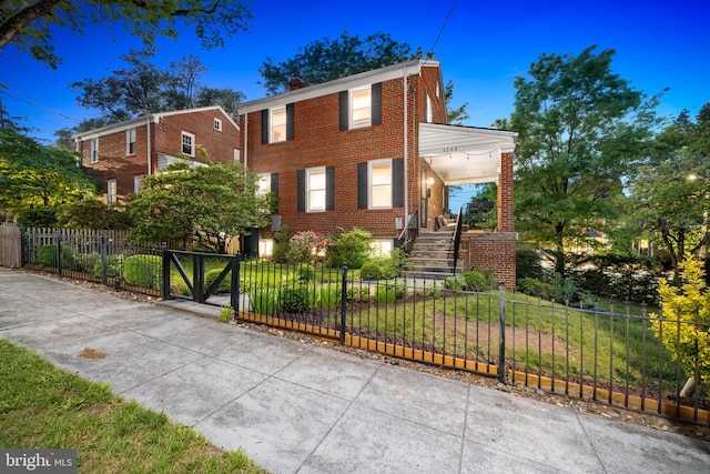4204 13th Pl NE, Washington, DC 20017 - view of front of house featuring brick siding, stairs, and a porch