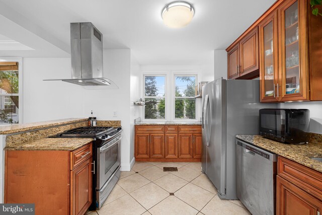 4204 13th Pl NE, Washington, DC 20017 - kitchen with appliances with stainless steel finishes, exhaust hood, healthy amount of natural light, and light stone counters