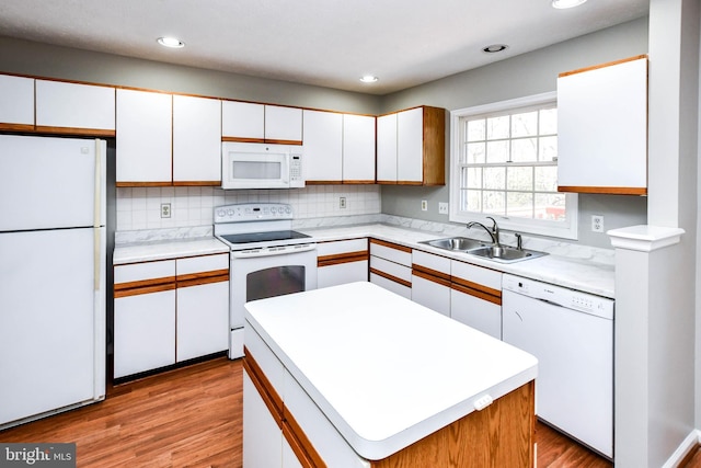 2156 Commissary Cir, Odenton, MD 21113 - kitchen with white appliances, a sink, light countertops, white cabinetry, and recessed lighting
