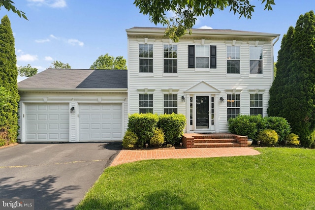 35934 Newberry Crossing Pl, Round Hill, VA 20141 - colonial home with an attached garage, driveway, and a front lawn