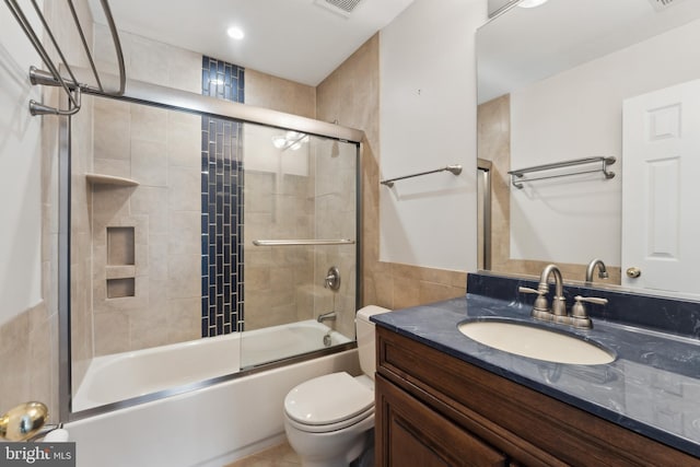 35934 Newberry Crossing Pl, Round Hill, VA 20141 - full bathroom with vanity, toilet, combined bath / shower with glass door, and tile walls