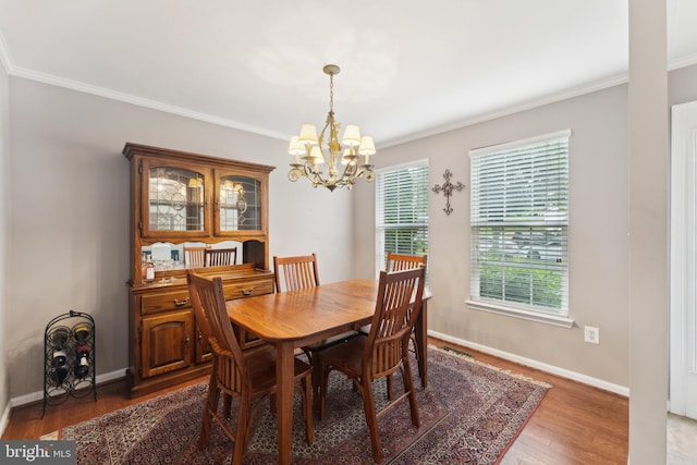 35934 Newberry Crossing Pl, Round Hill, VA 20141 - dining area featuring a chandelier, crown molding, light wood-style flooring, and baseboards
