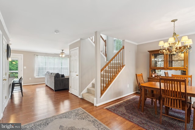 35934 Newberry Crossing Pl, Round Hill, VA 20141 - dining area featuring stairs, a chandelier, wood finished floors, baseboards, and ornamental molding