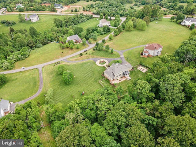 aerial view of property and surrounding area featuring rural landscape