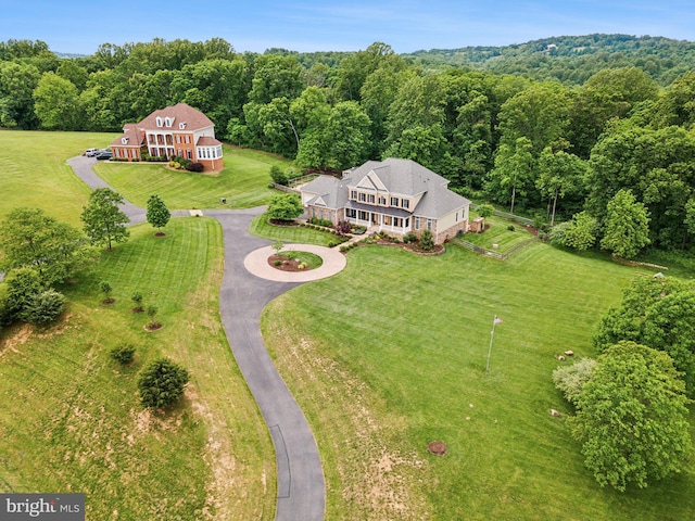 view from above of property featuring a forest
