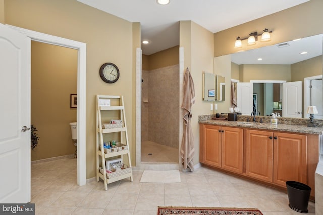 full bath featuring walk in shower, tile patterned flooring, vanity, baseboards, and recessed lighting