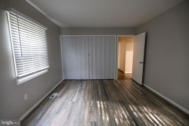 19 Rittenhouse Dr, Willingboro, NJ 08046 - unfurnished bedroom with wood finished floors, baseboards, a closet, and multiple windows