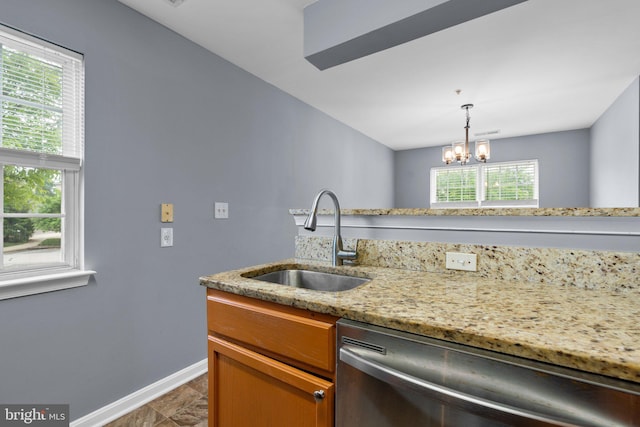 9150 Gracious End Ct Unit 104, Columbia, MD 21046 - kitchen featuring stainless steel dishwasher, a sink, baseboards, and plenty of natural light