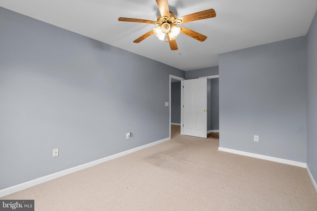 9150 Gracious End Ct Unit 104, Columbia, MD 21046 - spare room featuring light colored carpet, baseboards, and ceiling fan